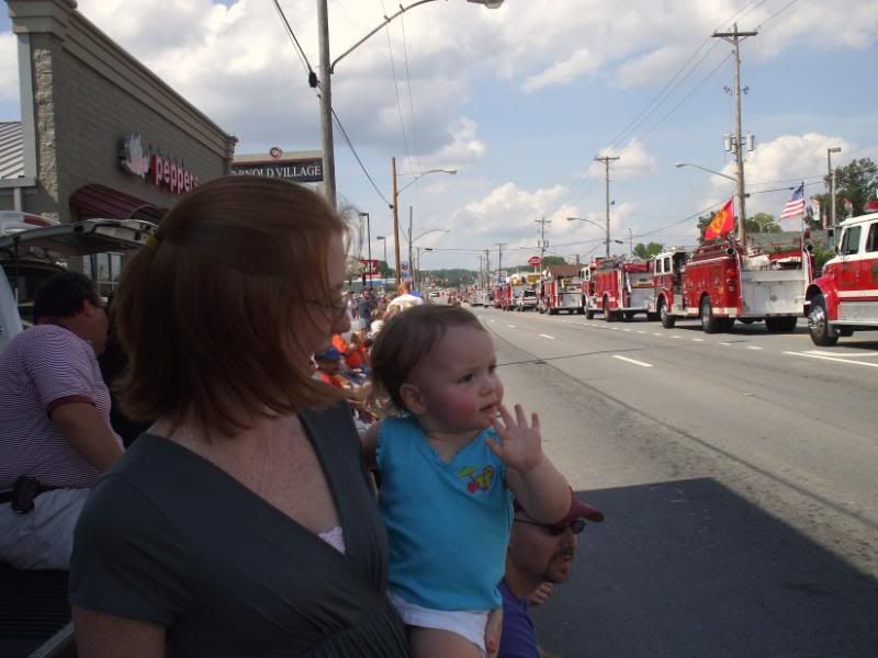 Kaytlin waving at floats